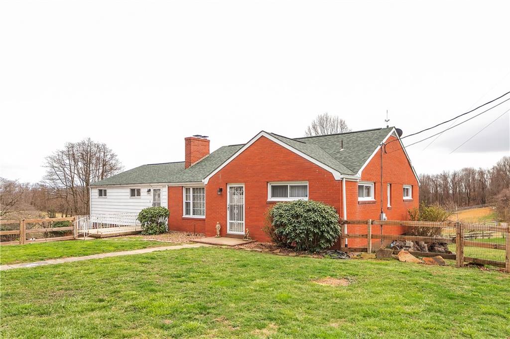 512 Middletown Road New Stanton, PA 15672 - Photo 2 of 24 a front view of a house with a yard