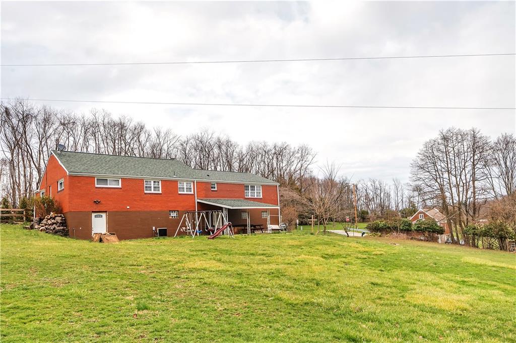 512 Middletown Road New Stanton, PA 15672 - Photo 22 of 24 a building view with a big yard