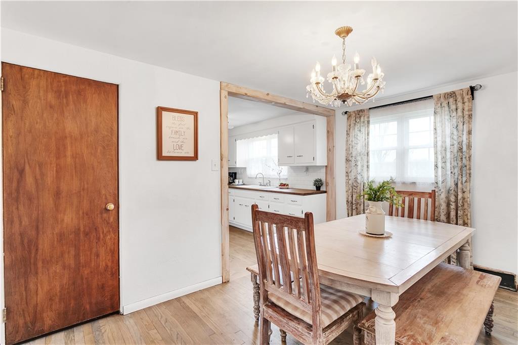512 Middletown Road New Stanton, PA 15672 - Photo 6 of 24 a view of a dining room with furniture window and wooden floor