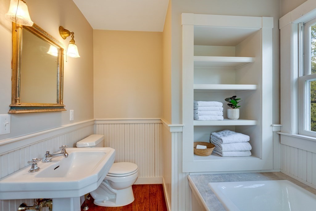742 Barretts Mill Road Concord, MA 01742 - Photo 12 of 38 a bathroom with a sink a toilet and vanity