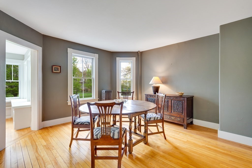 742 Barretts Mill Road Concord, MA 01742 - Photo 25 of 38 a dining room with furniture and wooden floor