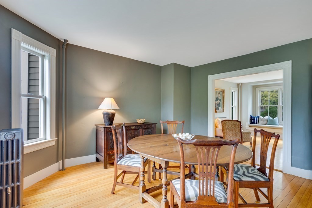 742 Barretts Mill Road Concord, MA 01742 - Photo 29 of 38 a view of a dining room with furniture and wooden floor