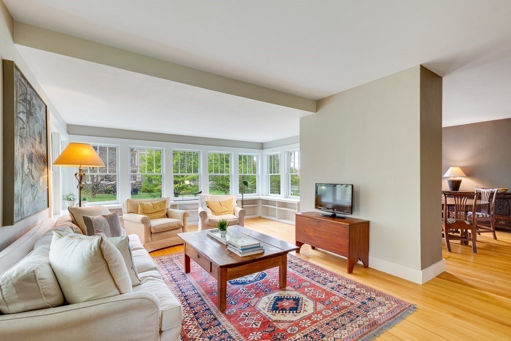 742 Barretts Mill Road Concord, MA 01742 - Photo 3 of 38 a living room with furniture and a table