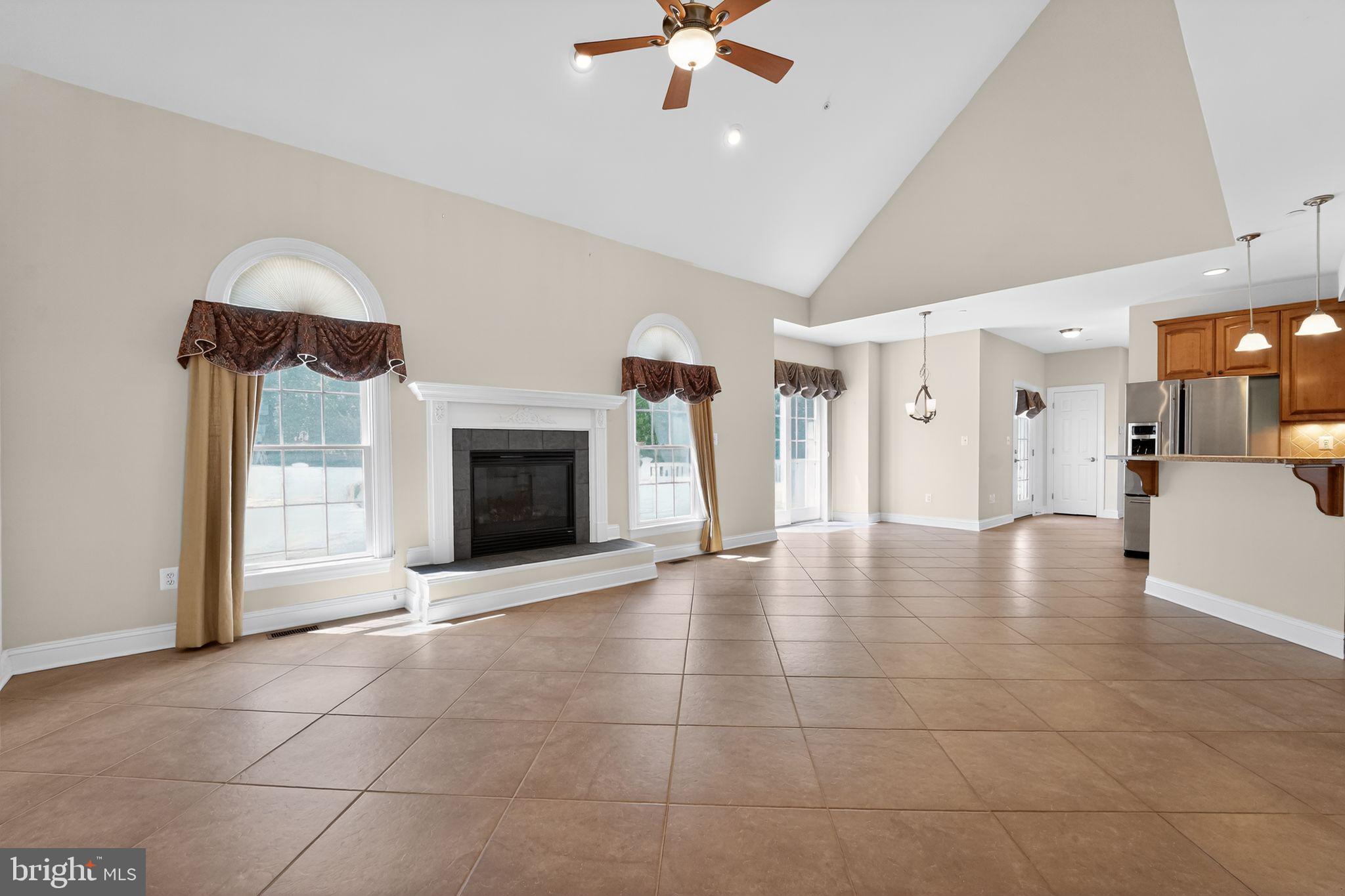 1165 Line Road Westminster, MD 21158 - Photo 19 of 75 a view of an empty room with a fireplace and a window