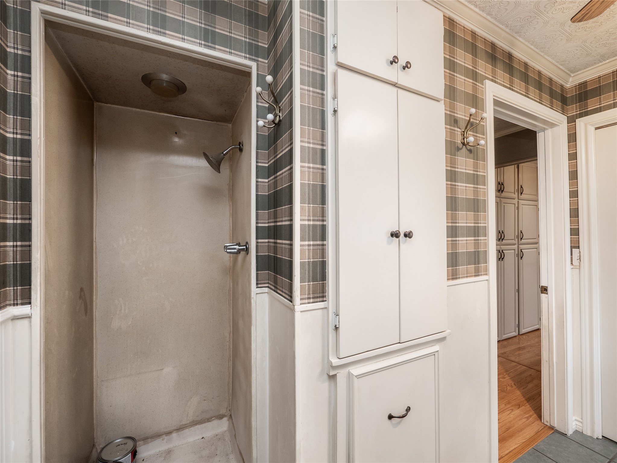 1350 County Road 414 Hamilton, TX 76531 - Photo 13 of 40 a bathroom with a glass shower door