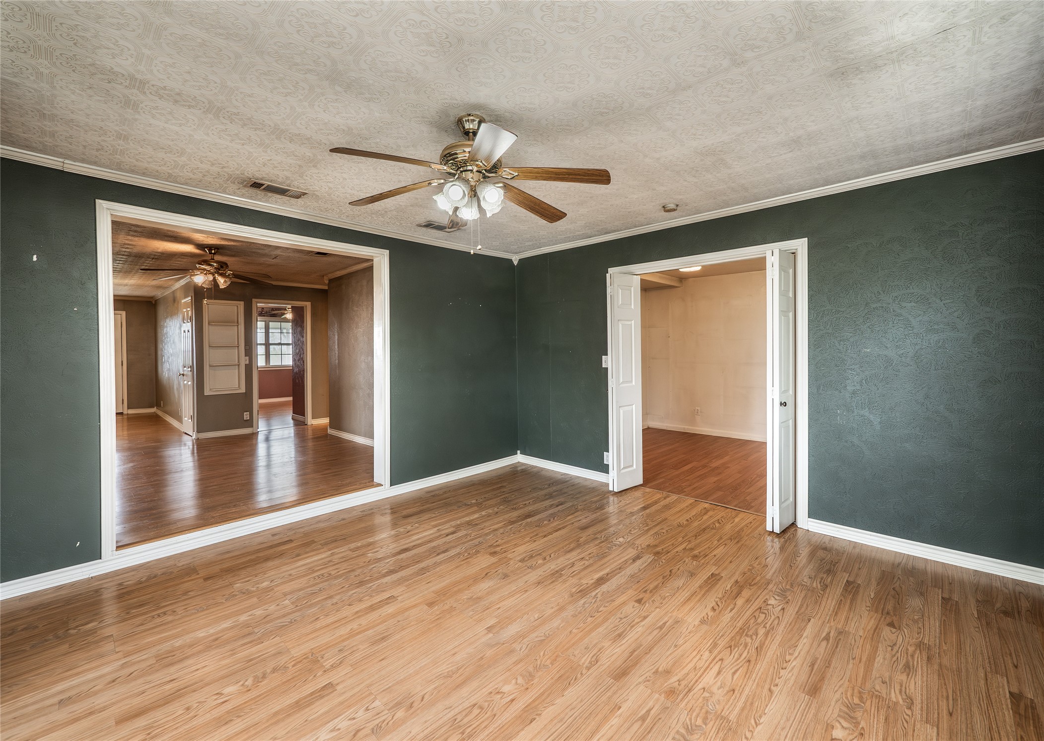 1350 County Road 414 Hamilton, TX 76531 - Photo 15 of 40 a view of empty room with wooden floor and fan
