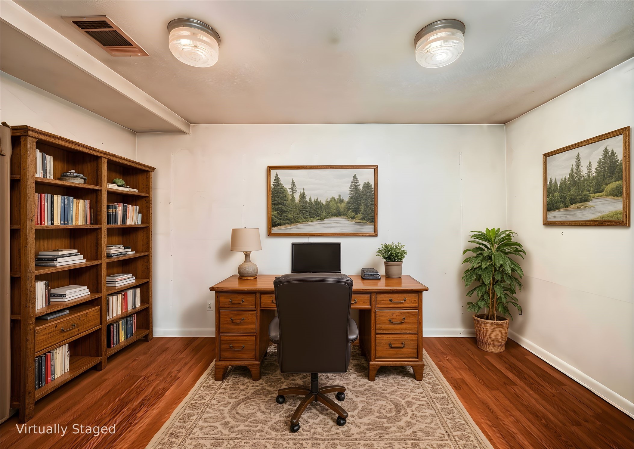 1350 County Road 414 Hamilton, TX 76531 - Photo 16 of 40 a workspace with furniture bookshelf and a wooden floor