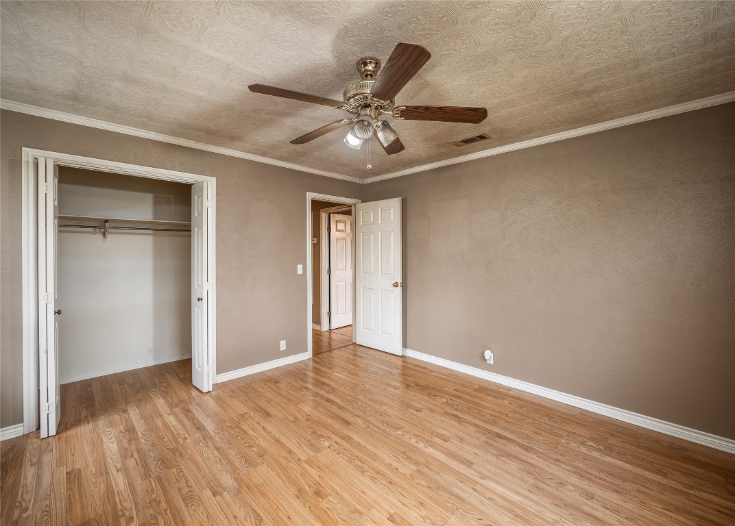 1350 County Road 414 Hamilton, TX 76531 - Photo 23 of 40 a view of an empty room with wooden floor