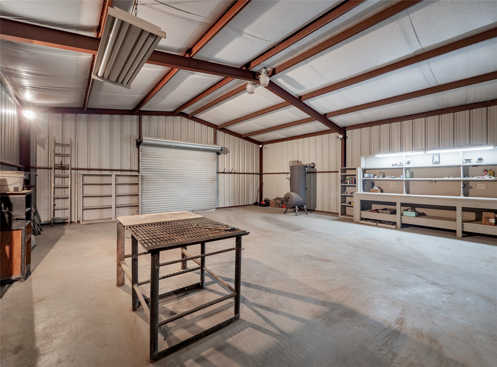 1350 County Road 414 Hamilton, TX 76531 - Photo 31 of 40 a view of storage and utility room with stairs