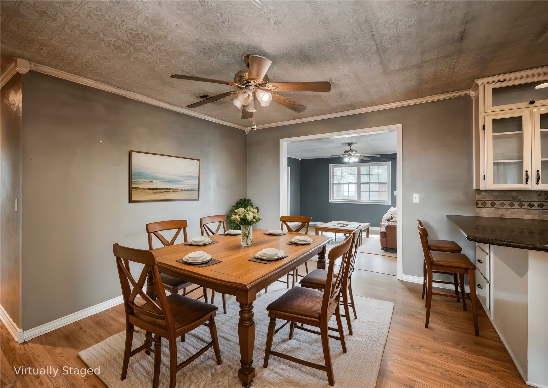 1350 County Road 414 Hamilton, TX 76531 - Photo 6 of 40 a view of a dining room with furniture and wooden floor