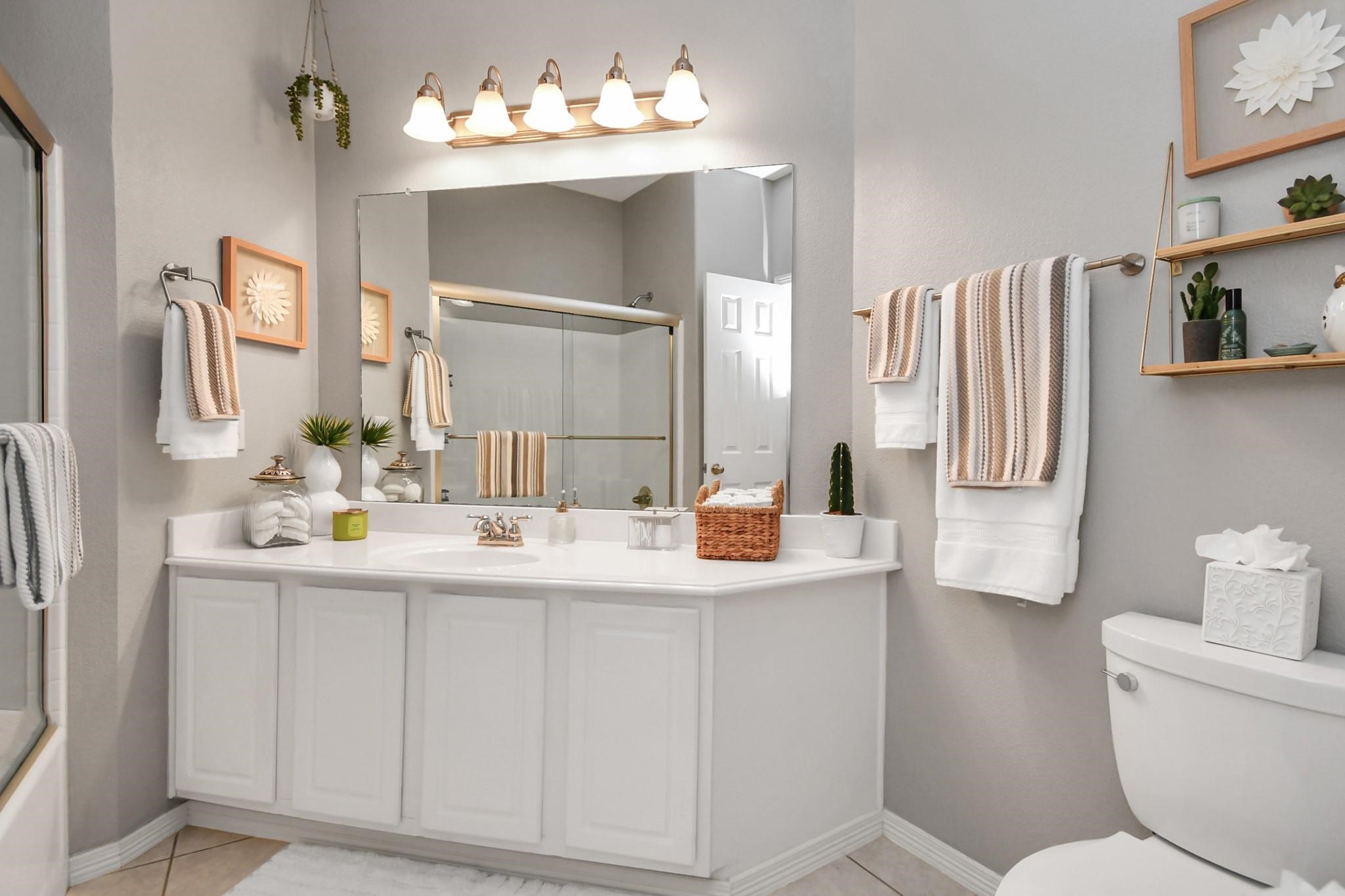 8624 Sunset Loch Drive Spring, TX 77379 - Photo 30 of 44 a bathroom with a sink double vanity and a mirror