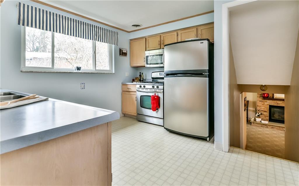 8409 Edwood Road Pittsburgh, PA 15237 - Photo 14 of 25 Plenty of natural light coming in this fully equipped kitchen with stainless steel appliances.