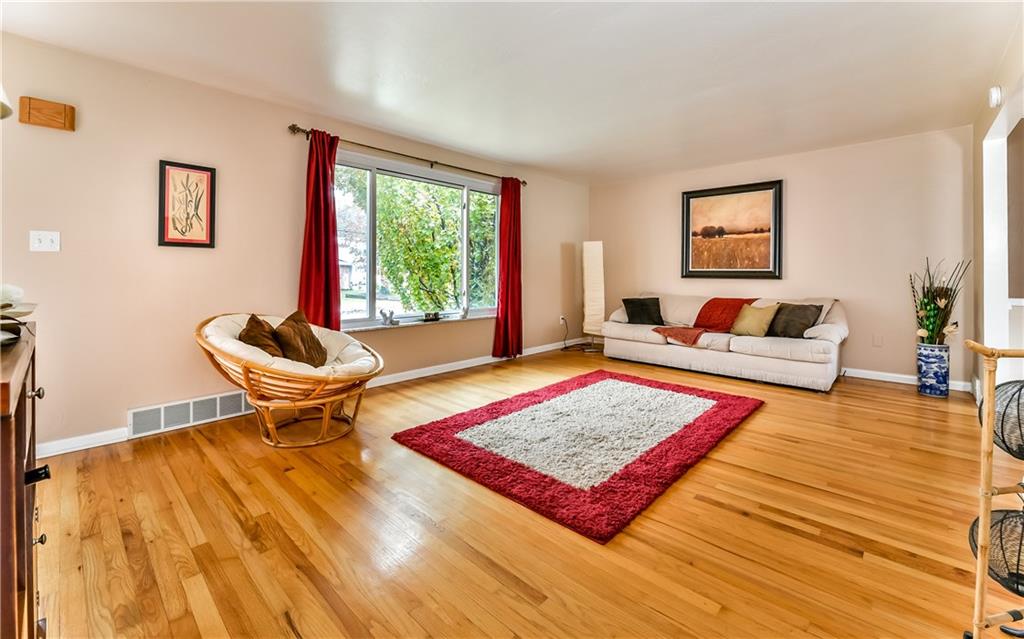 8409 Edwood Road Pittsburgh, PA 15237 - Photo 8 of 25 Spacious and cozy living room that accommodates large furniture and decor.