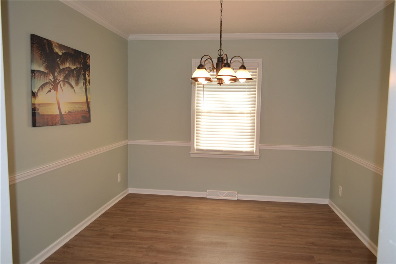 7249 Rock Service Station Road Raleigh, NC 27603 - Photo 13 of 25 Updated new with new paint, new luxury flooring, new lighting. Elegant Dining Room