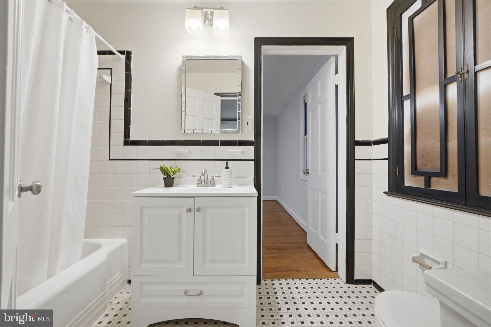 5910 Overlea Road Bethesda, MD 20816 - Photo 21 of 56 a bathroom with a sink a toilet and shower