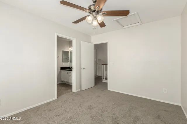 a bathroom with a granite countertop sink a mirror and a shower