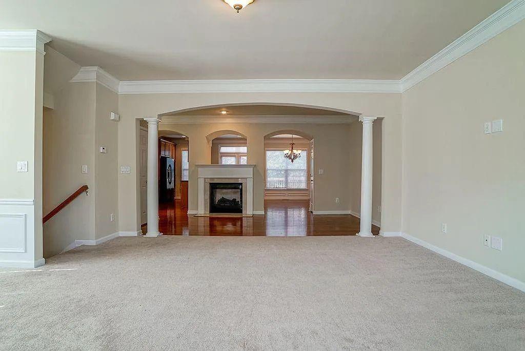 6120 Joybrook Road Duluth, GA 30097 - Photo 5 of 30 a view of an empty room with a fireplace