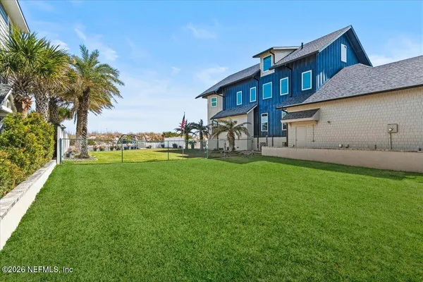 a front view of house with yard and outdoor seating