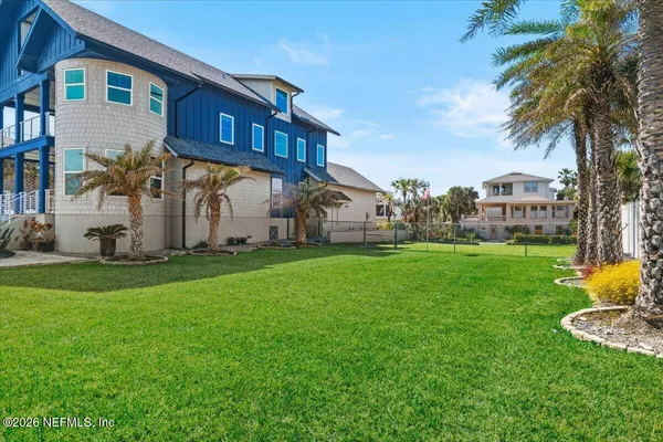 a view of a house with a yard porch and sitting area