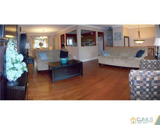 9 Glendale Road Colonia, NJ 07067 - Photo 4 of 19 a living room with furniture and a wooden floor
