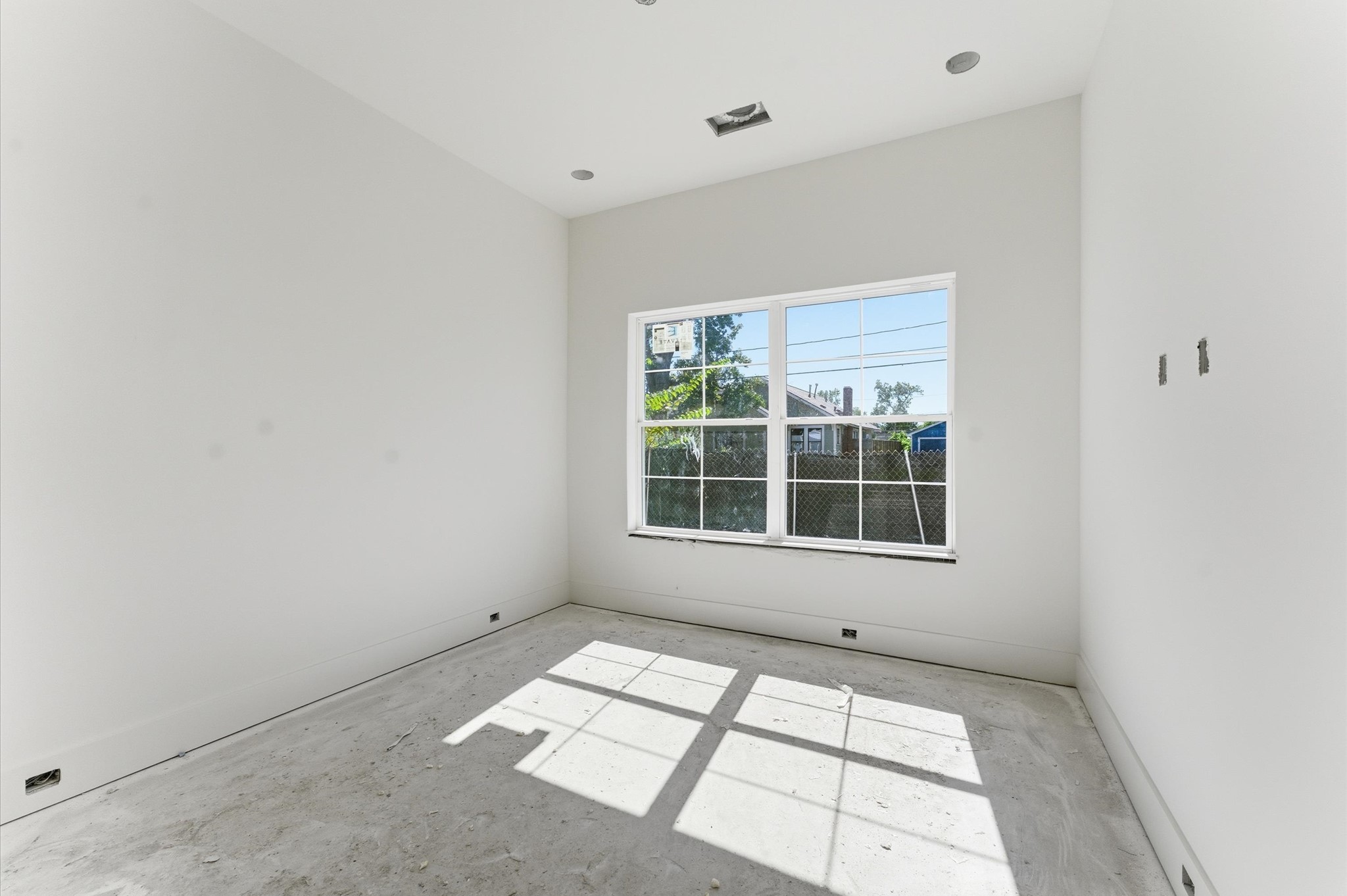 1106 Robbie Street Houston, TX 77009 - Photo 8 of 38 a view of an empty room with a window