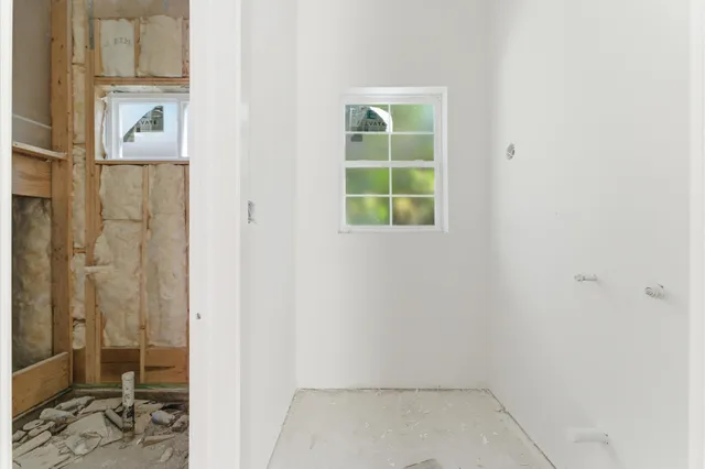 a view of an empty room with a window