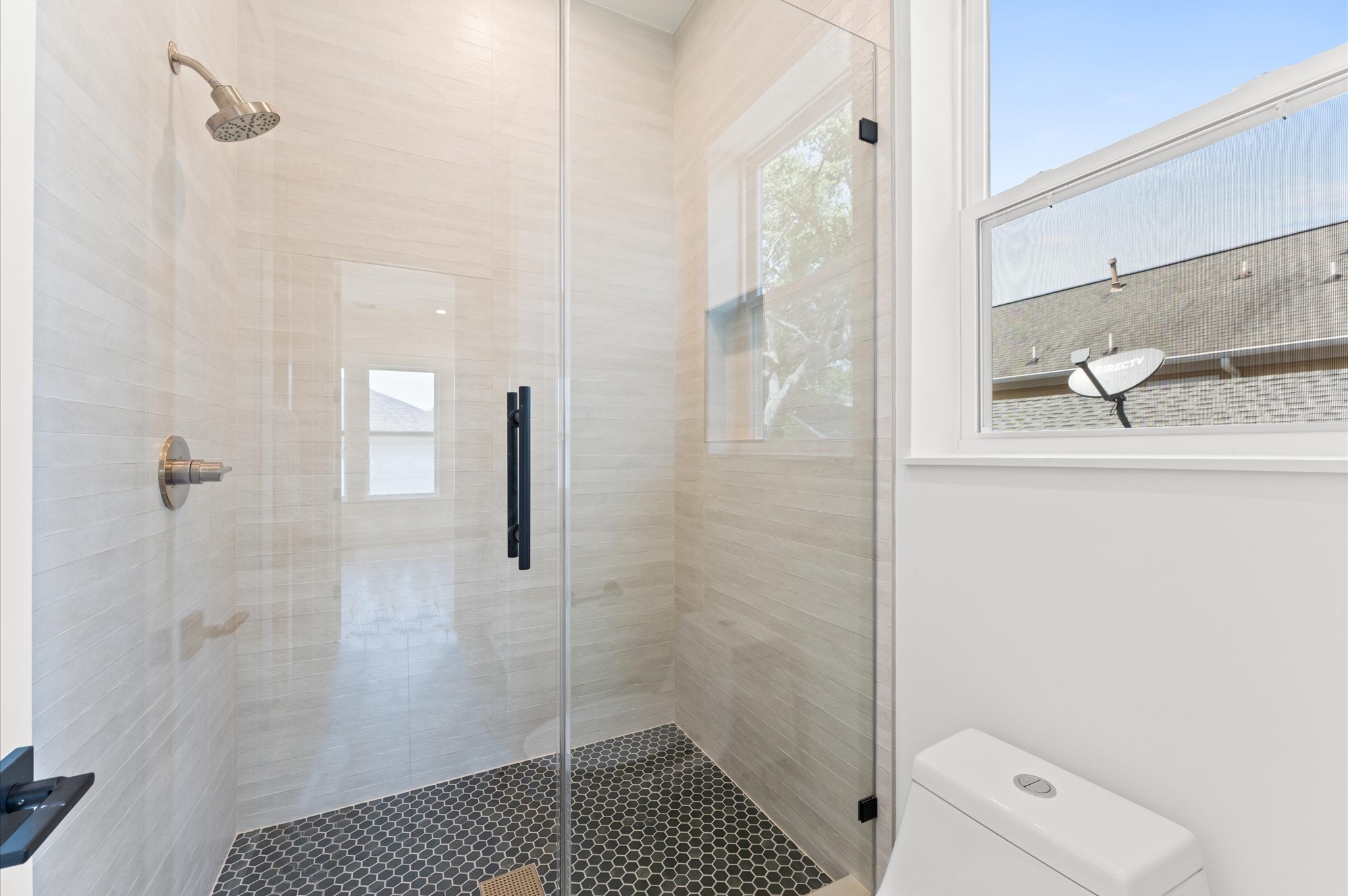 1106 Robbie Street Houston, TX 77009 - Photo 29 of 38 a bathroom with a shower and toilet