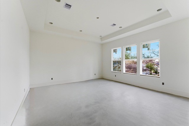 1106 Robbie Street Houston, TX 77009 - Photo 10 of 36 Primary bedroom is enhanced by natural light and a tray ceiling, which contributes to its architectural style.