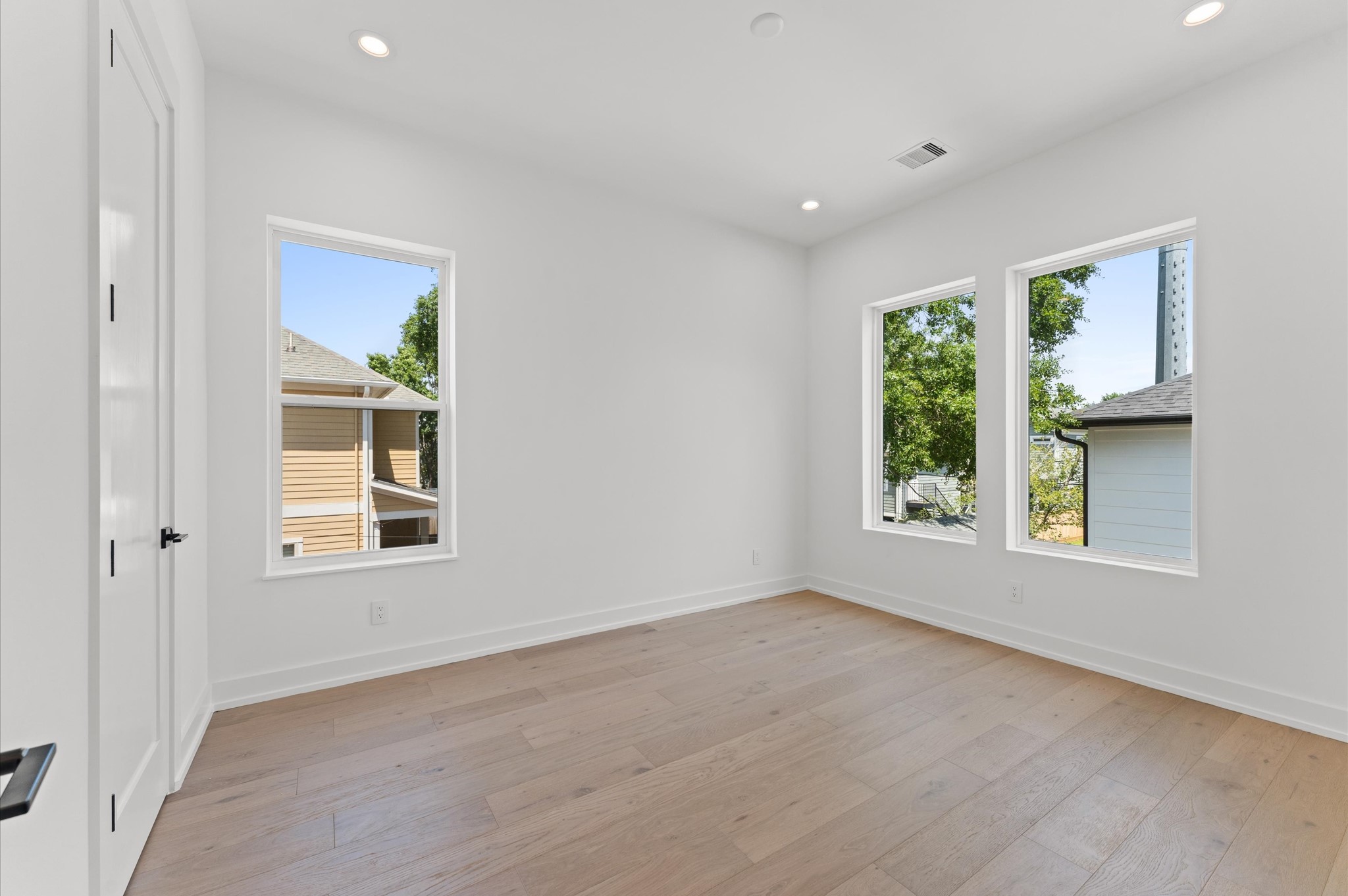 1106 Robbie Street Houston, TX 77009 - Photo 35 of 38 an empty room with windows and entrance