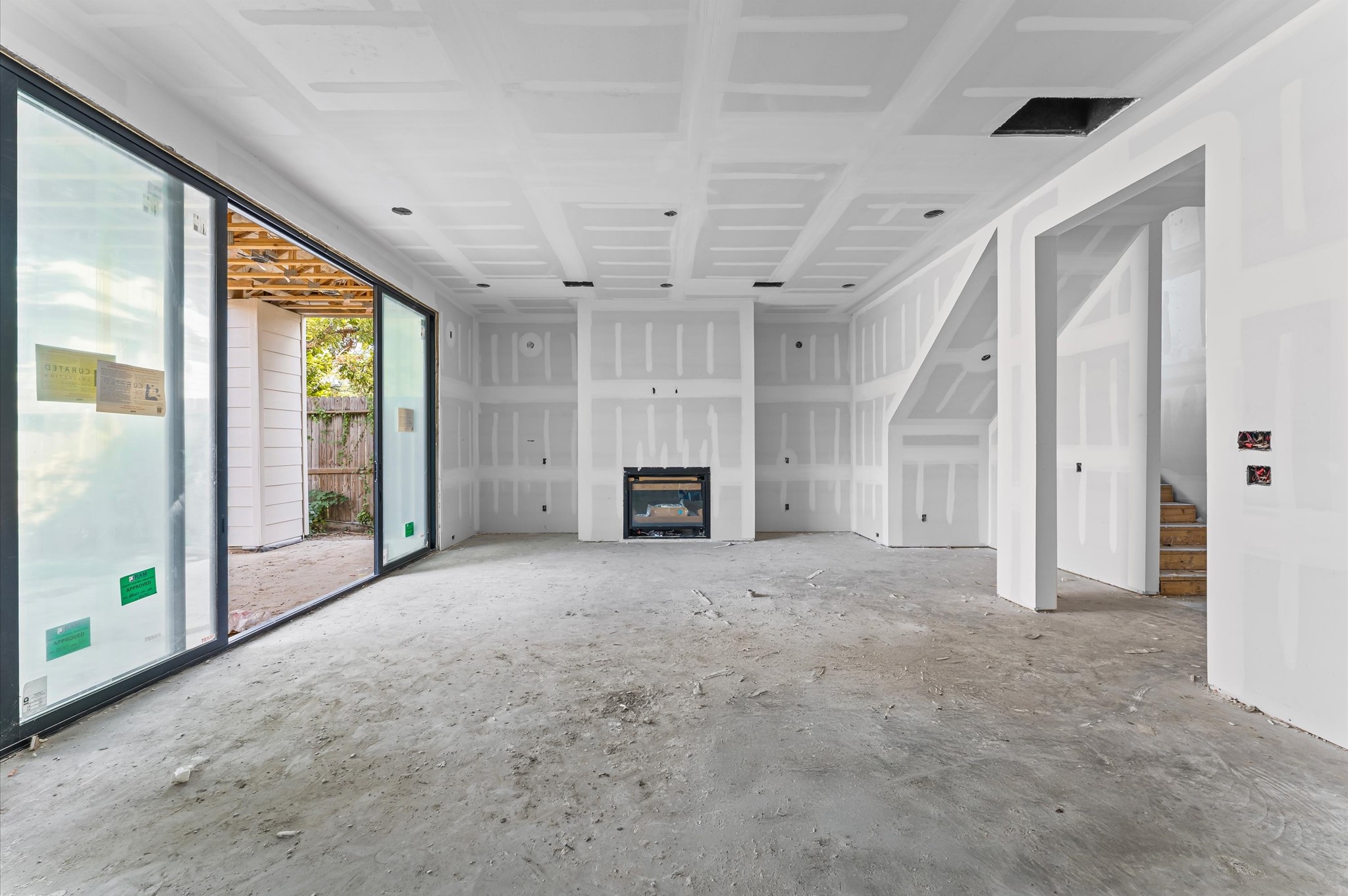 1106 Robbie Street Houston, TX 77009 - Photo 6 of 38 en empty room with windows and fireplace
