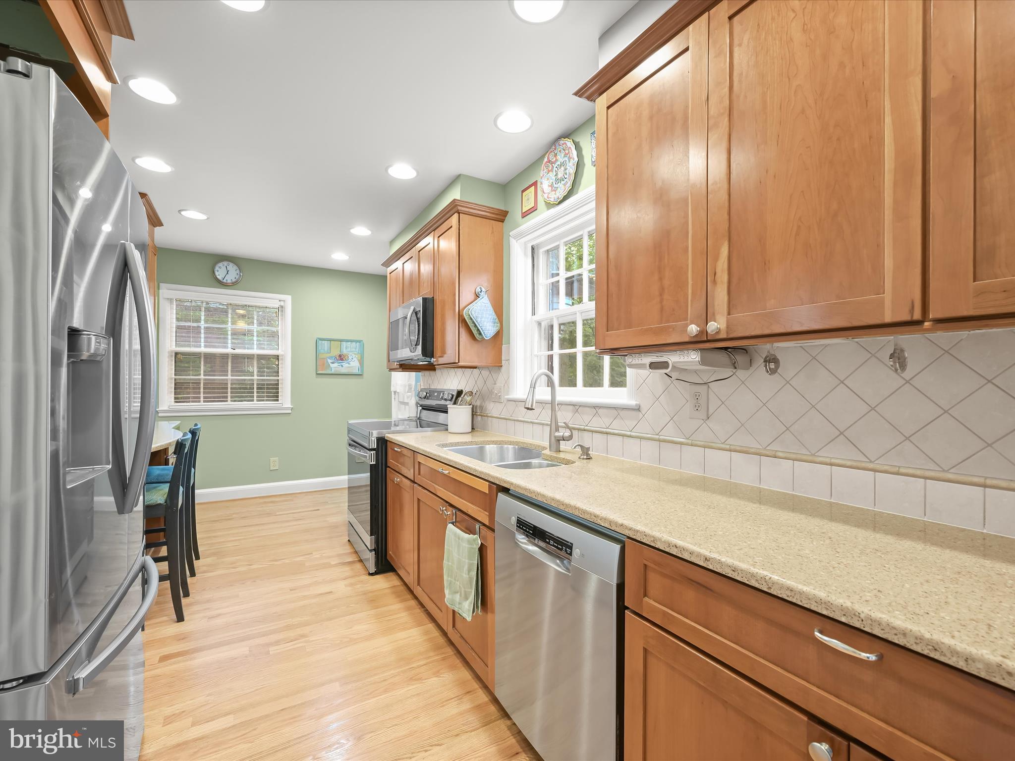 4005 Clagett Road Hyattsville, MD 20782 - Photo 12 of 50 a large kitchen with stainless steel appliances granite countertop a sink and a stove
