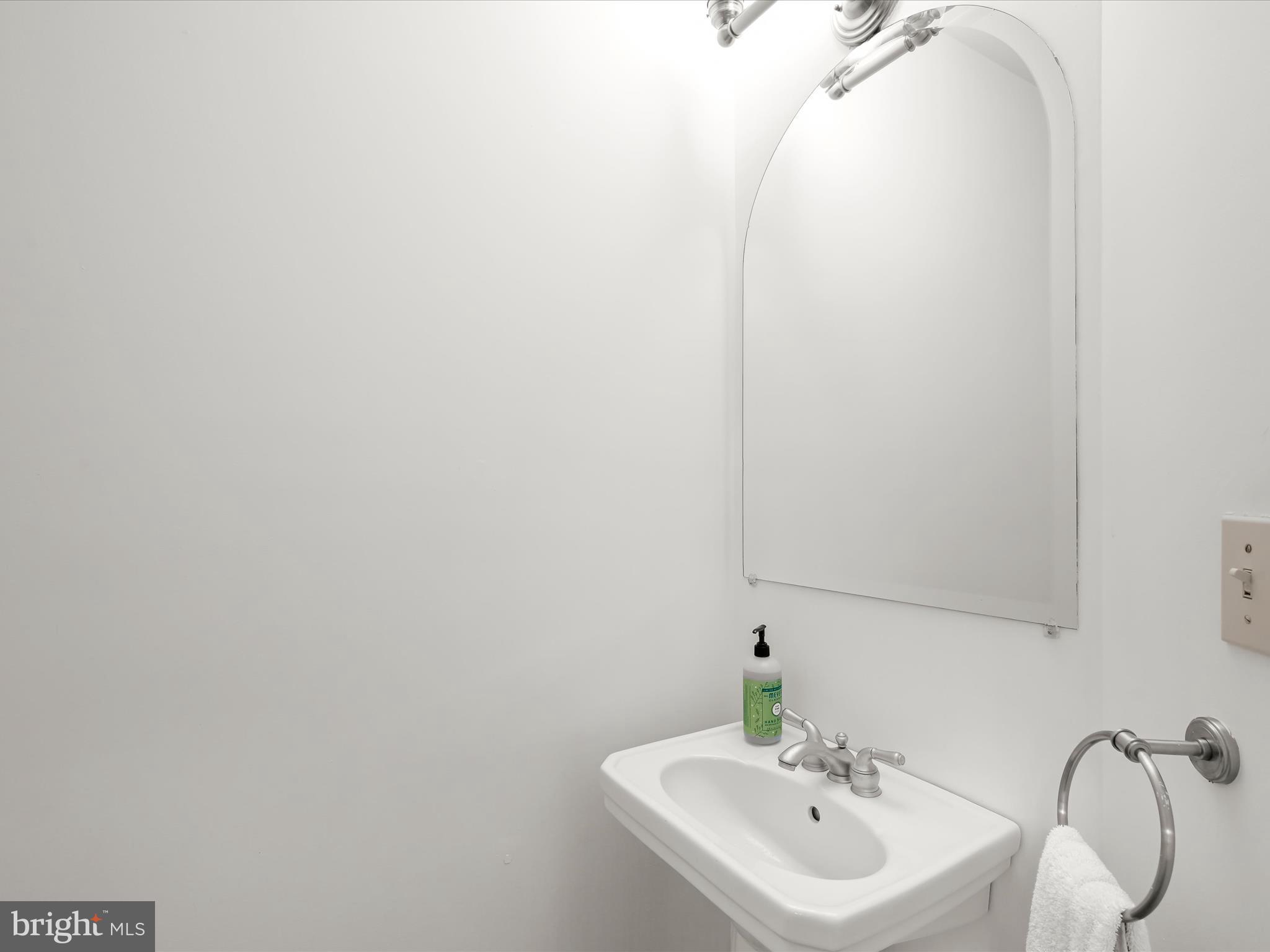 4005 Clagett Road Hyattsville, MD 20782 - Photo 16 of 50 a bathroom with a sink and a mirror