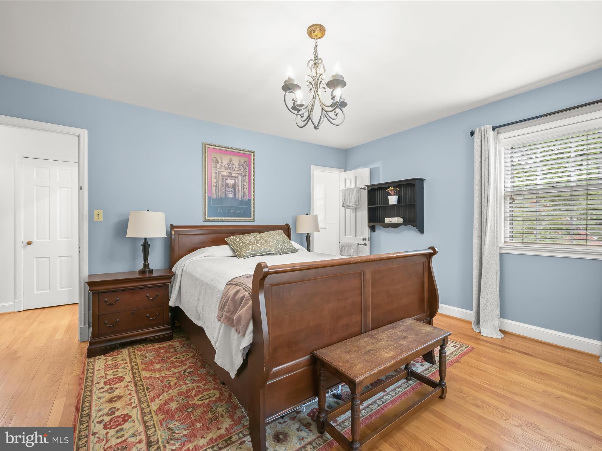 4005 Clagett Road Hyattsville, MD 20782 - Photo 18 of 50 a bed room with a bed and a chandelier