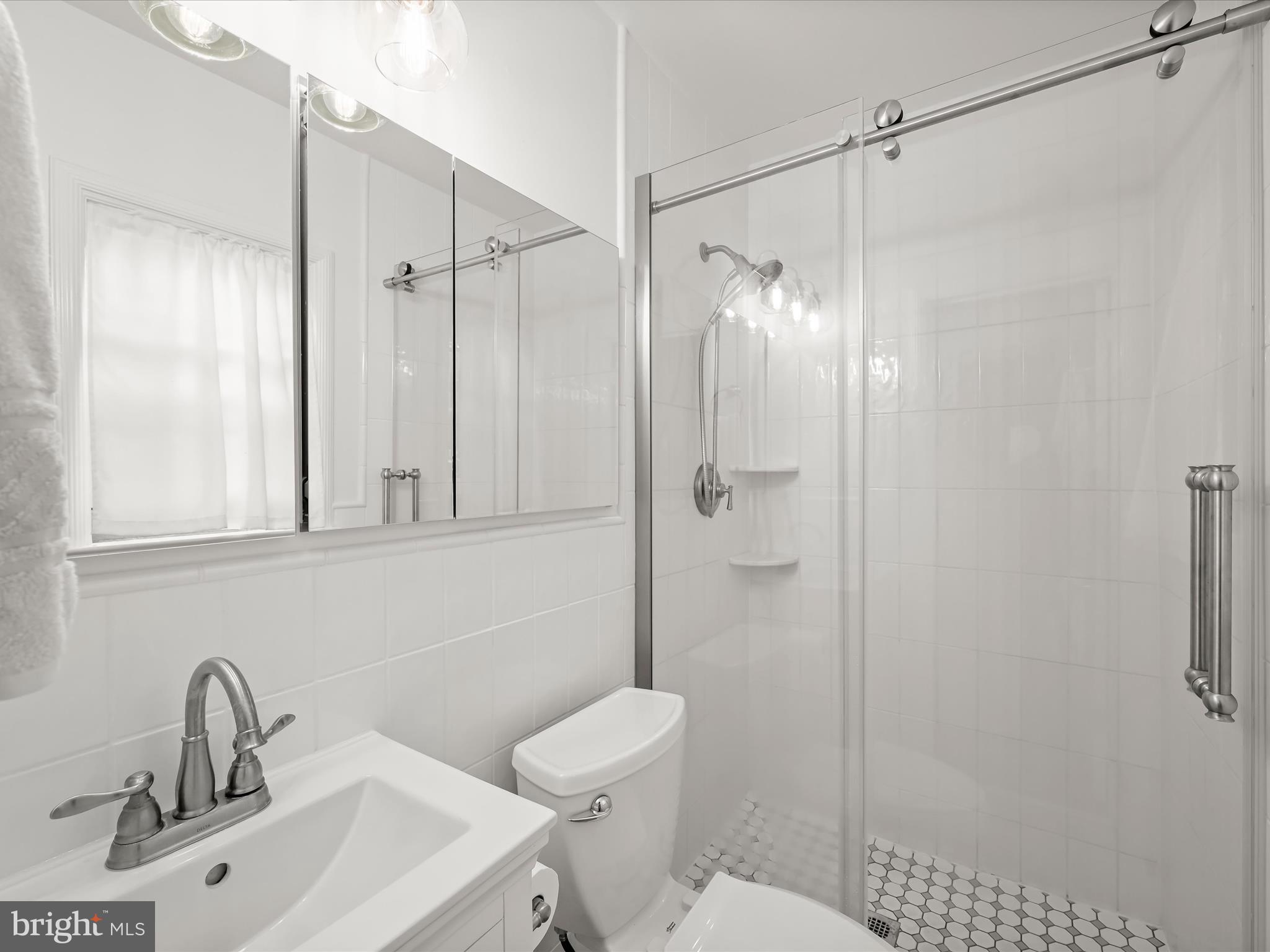4005 Clagett Road Hyattsville, MD 20782 - Photo 19 of 50 a bathroom with a sink toilet and shower