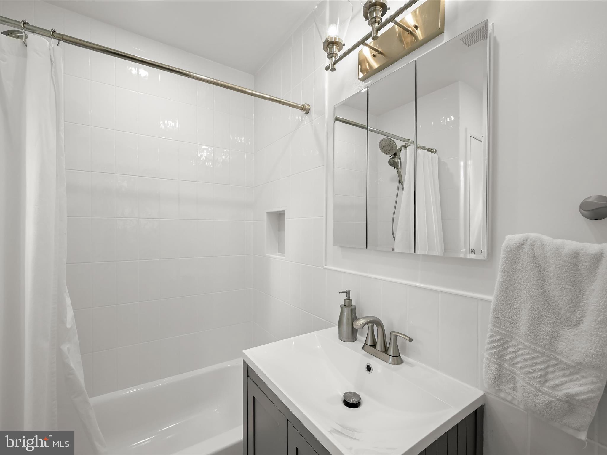 4005 Clagett Road Hyattsville, MD 20782 - Photo 24 of 50 a bathroom with a sink and a mirror