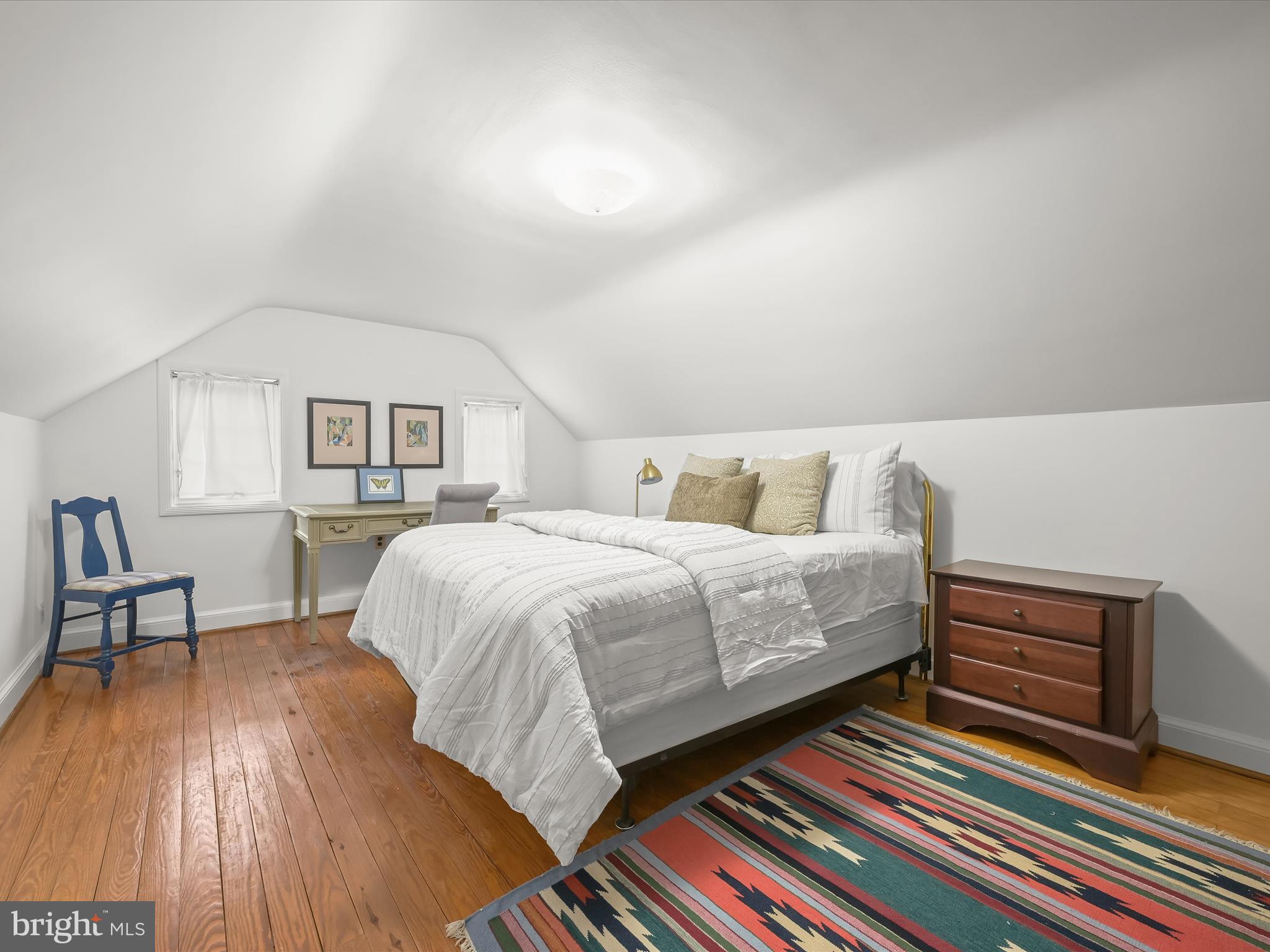 4005 Clagett Road Hyattsville, MD 20782 - Photo 25 of 50 a bedroom with a bed and a bookshelf with wooden floor