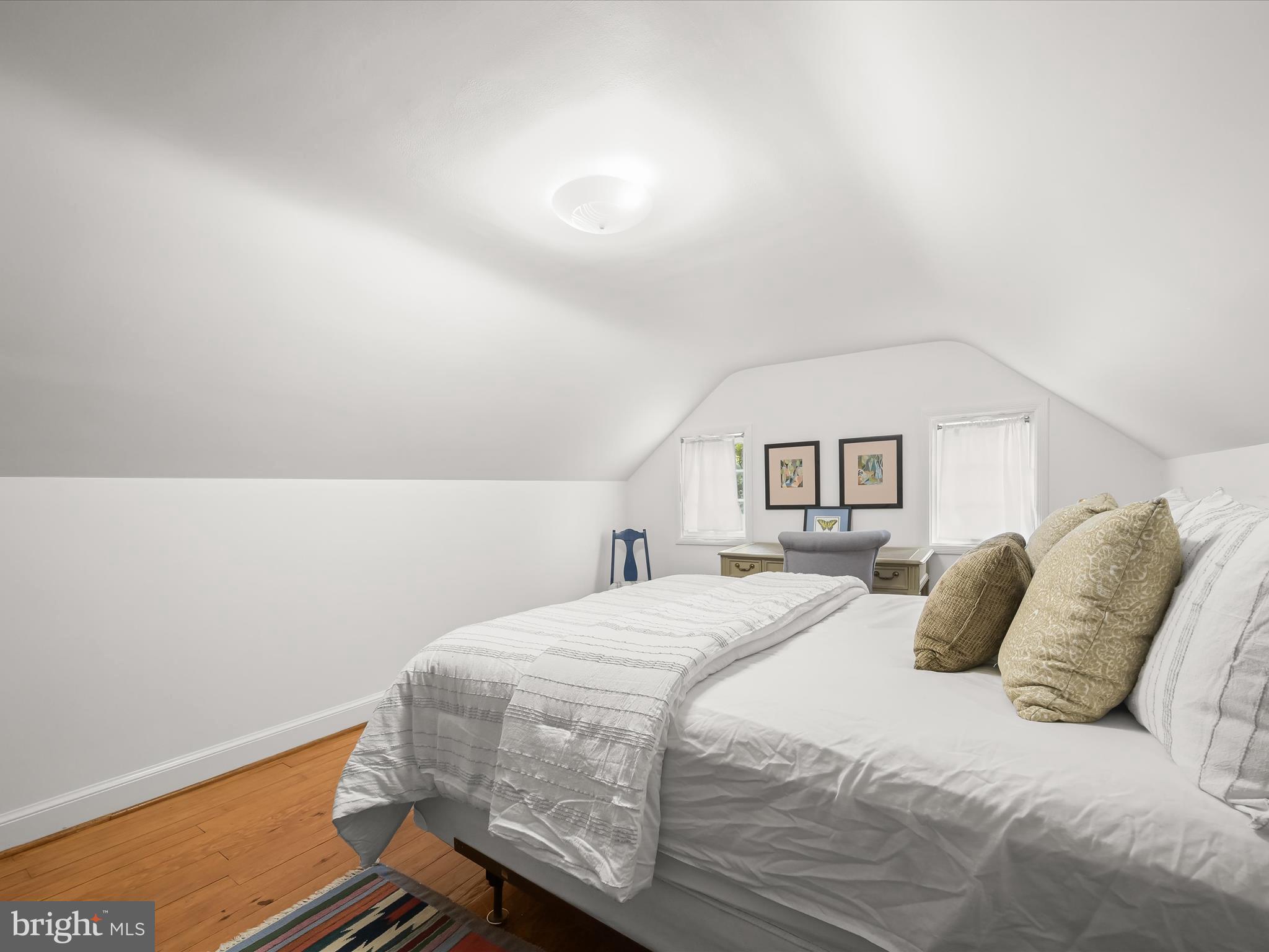 4005 Clagett Road Hyattsville, MD 20782 - Photo 26 of 50 a bedroom with a bed and a painting on the wall