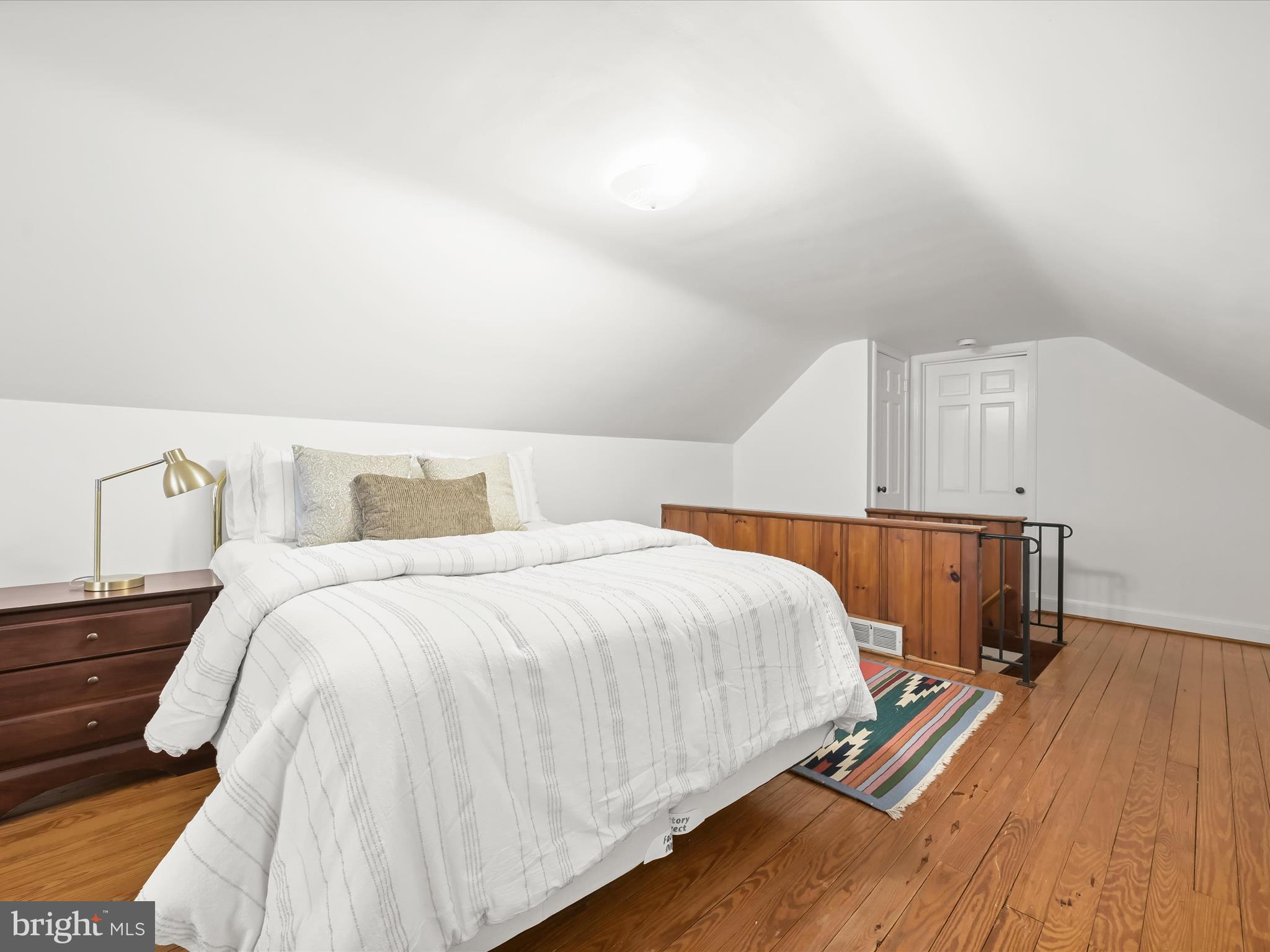 4005 Clagett Road Hyattsville, MD 20782 - Photo 27 of 50 a bedroom with a bed and a night stand