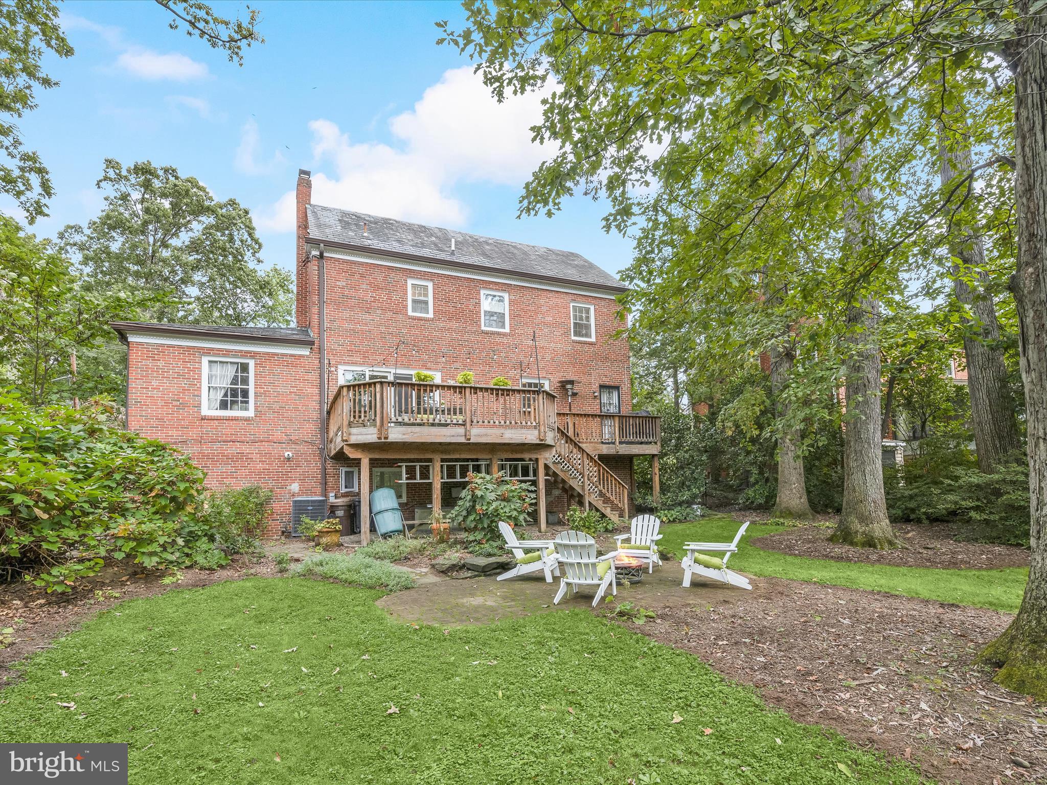 4005 Clagett Road Hyattsville, MD 20782 - Photo 33 of 50 a view of a brick house with a yard patio and sitting area