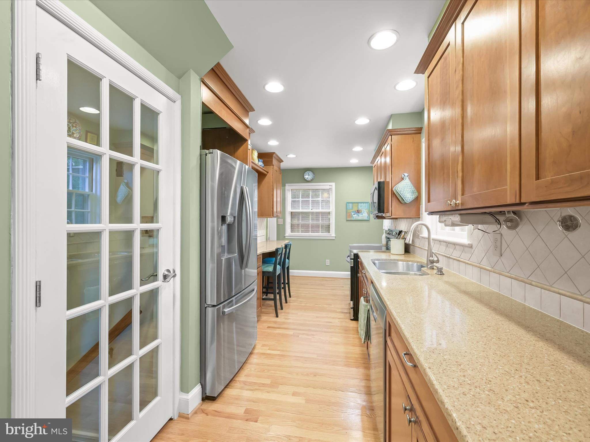 4005 Clagett Road Hyattsville, MD 20782 - Photo 10 of 50 a bathroom with a granite countertop sink a mirror and shower