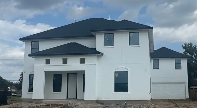 a front view of a house with yard