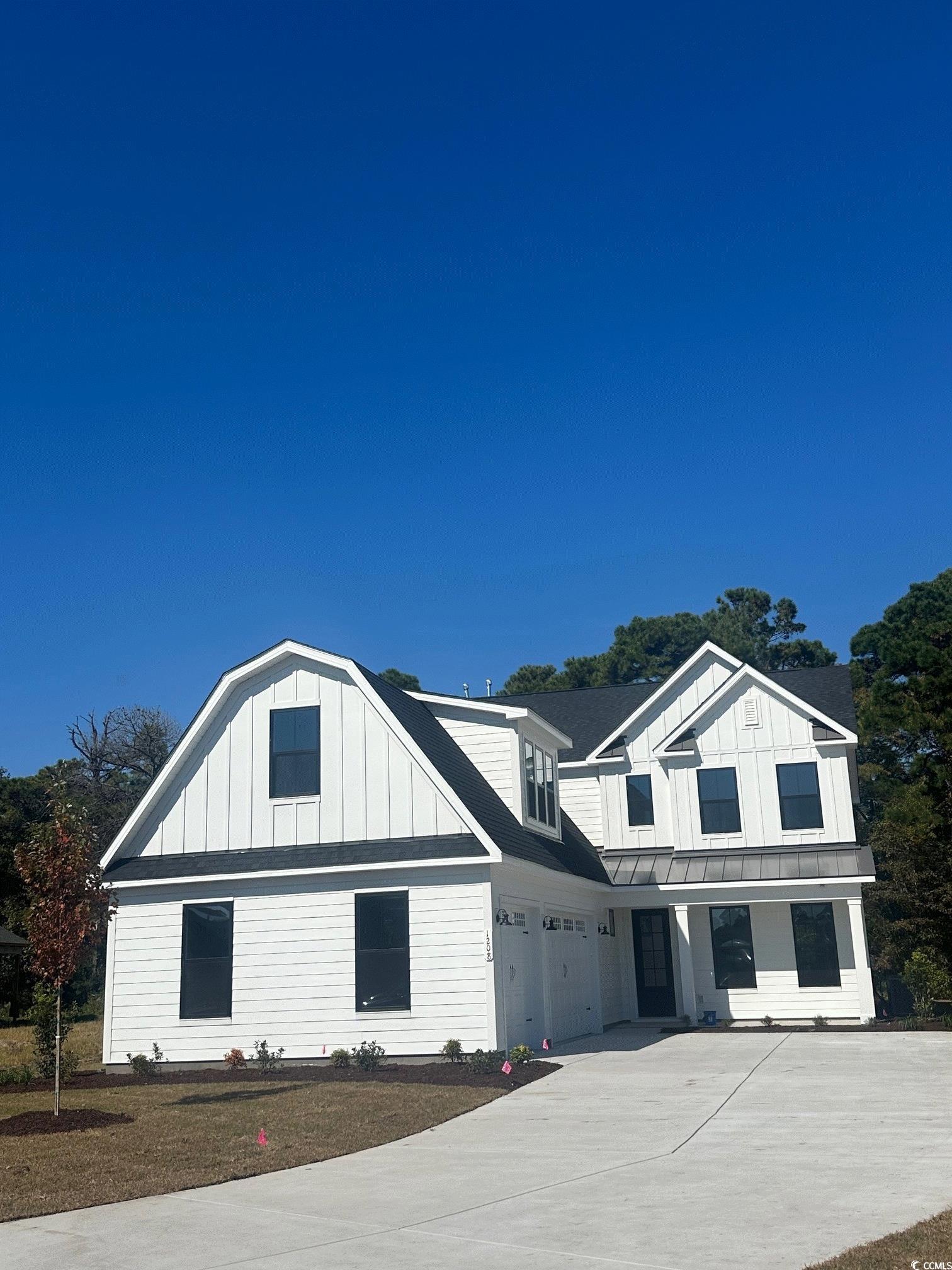 1208 Needle Grass Loop Myrtle Beach, SC 29579 - Photo 1 of 9 View of front of home featuring a garage