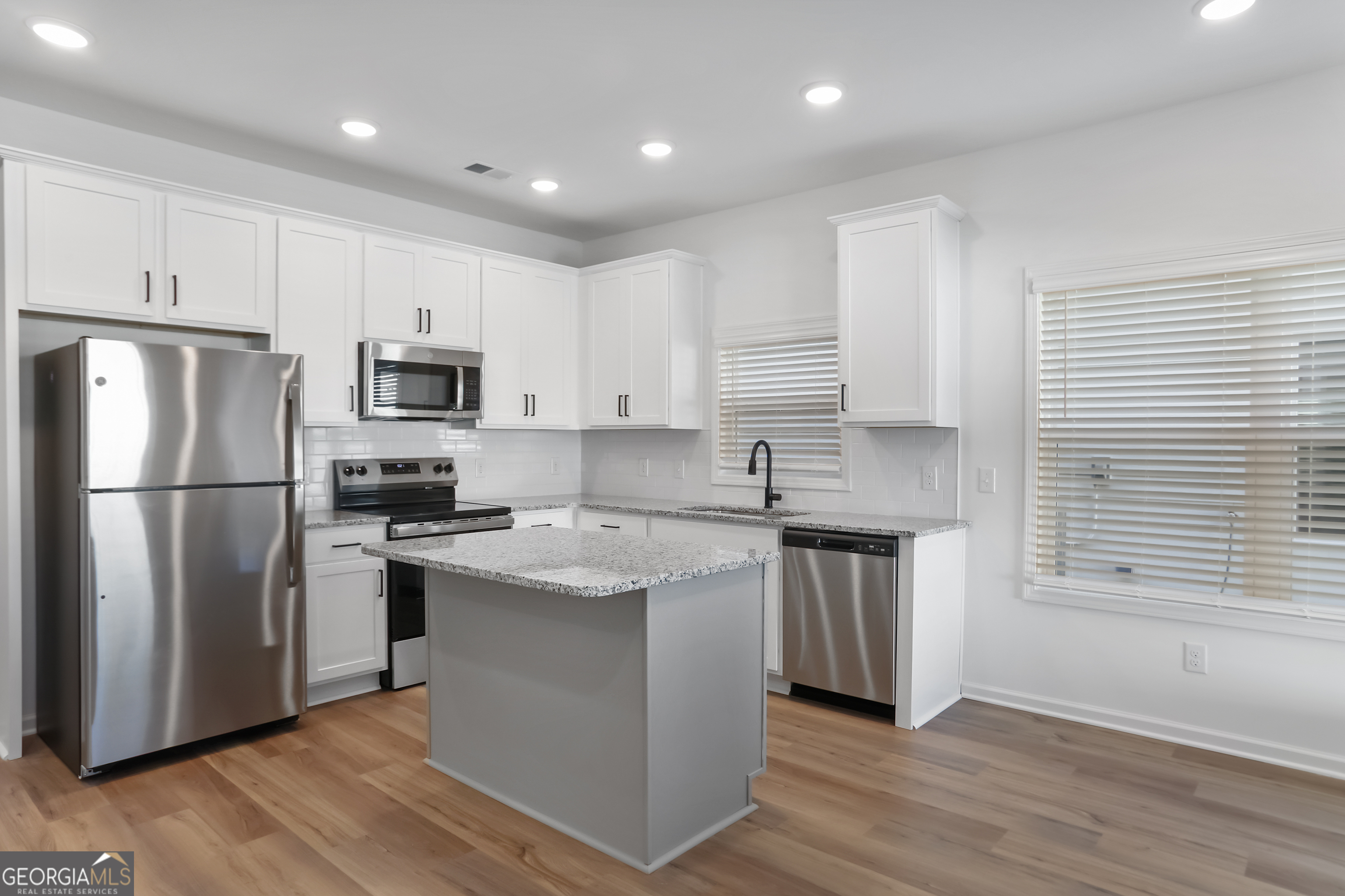 158 Jackson Circle, Unit 19 Cleveland, GA 30528 - Photo 8 of 25 Stainless steel appliances include, range, microwave and dishwasher. Frig is not included.