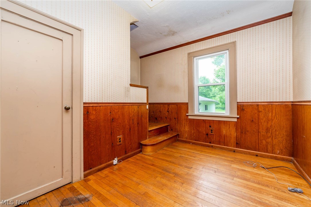 7490 Race Road North Ridgeville, OH 44039 - Photo 10 of 20 First floor den/office has hardwood flooring and leads up to the master bedroom