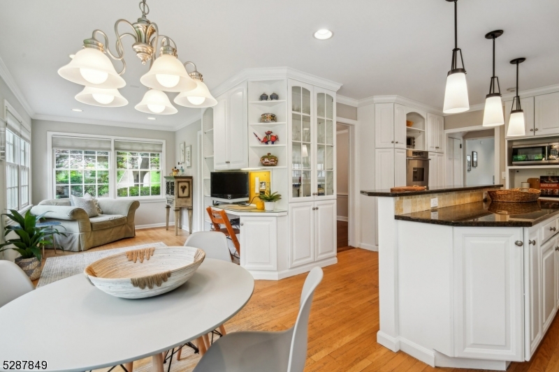 a view of a kitchen area kitchen island dining table and chairs