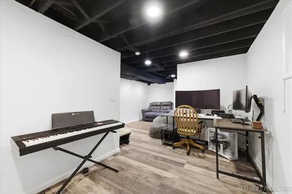 a livingroom with workspace and a couch