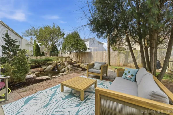 a view of a terrace with couches and a fire pit
