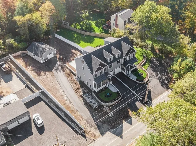 an aerial view of house with yard