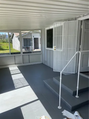 a view of entry way with wooden door