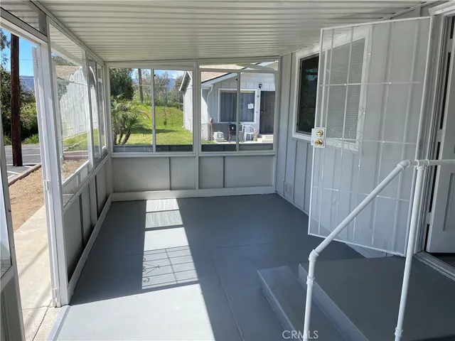 a kitchen with stainless steel appliances granite countertop a stove a sink and white cabinets